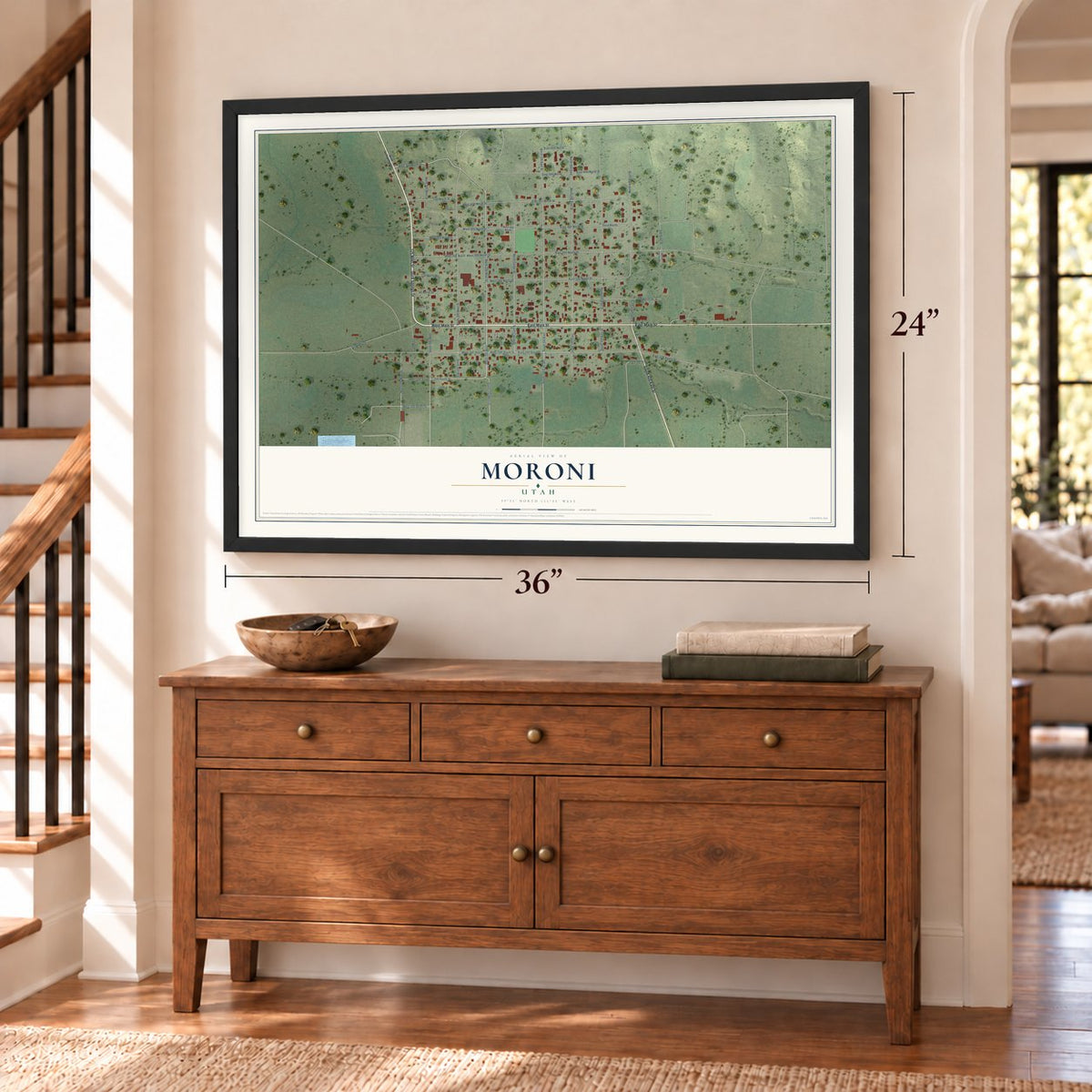 Moroni, Utah map, 24 x 36 inch print in a black frame above a dresser by a staircase