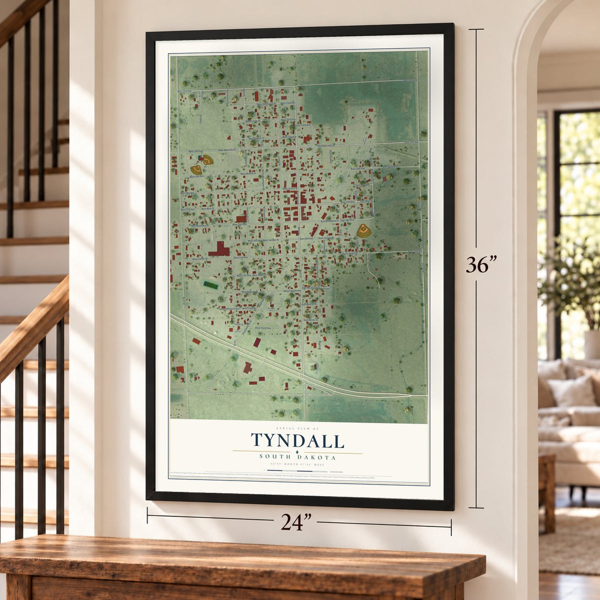 Tyndall, South Dakota map, 24 x 36 inch print in a black frame by a staircase