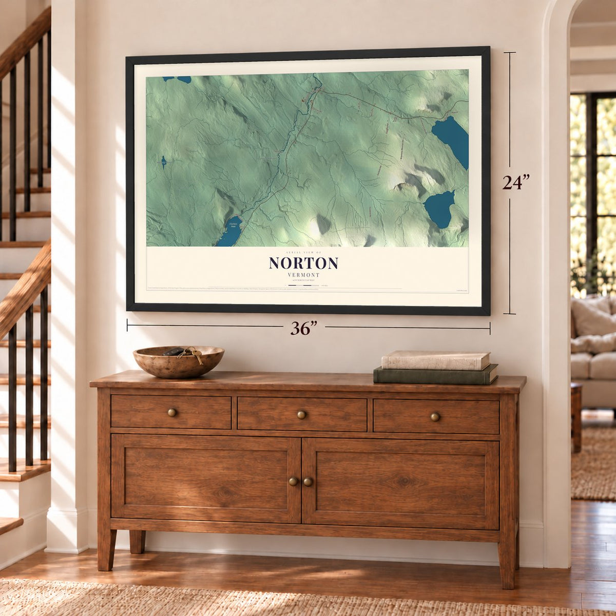 Norton, Vermont map, 24 x 36 inch print in a black frame above a dresser by a staircase