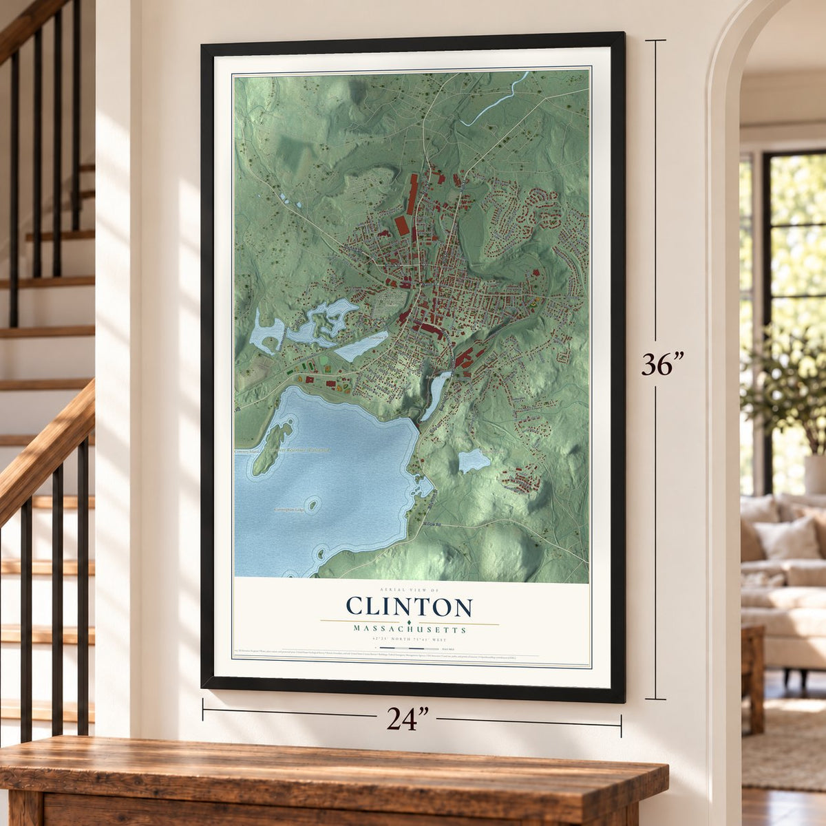 Clinton, Massachusetts map, 24 x 36 inch print in a black frame by a staircase