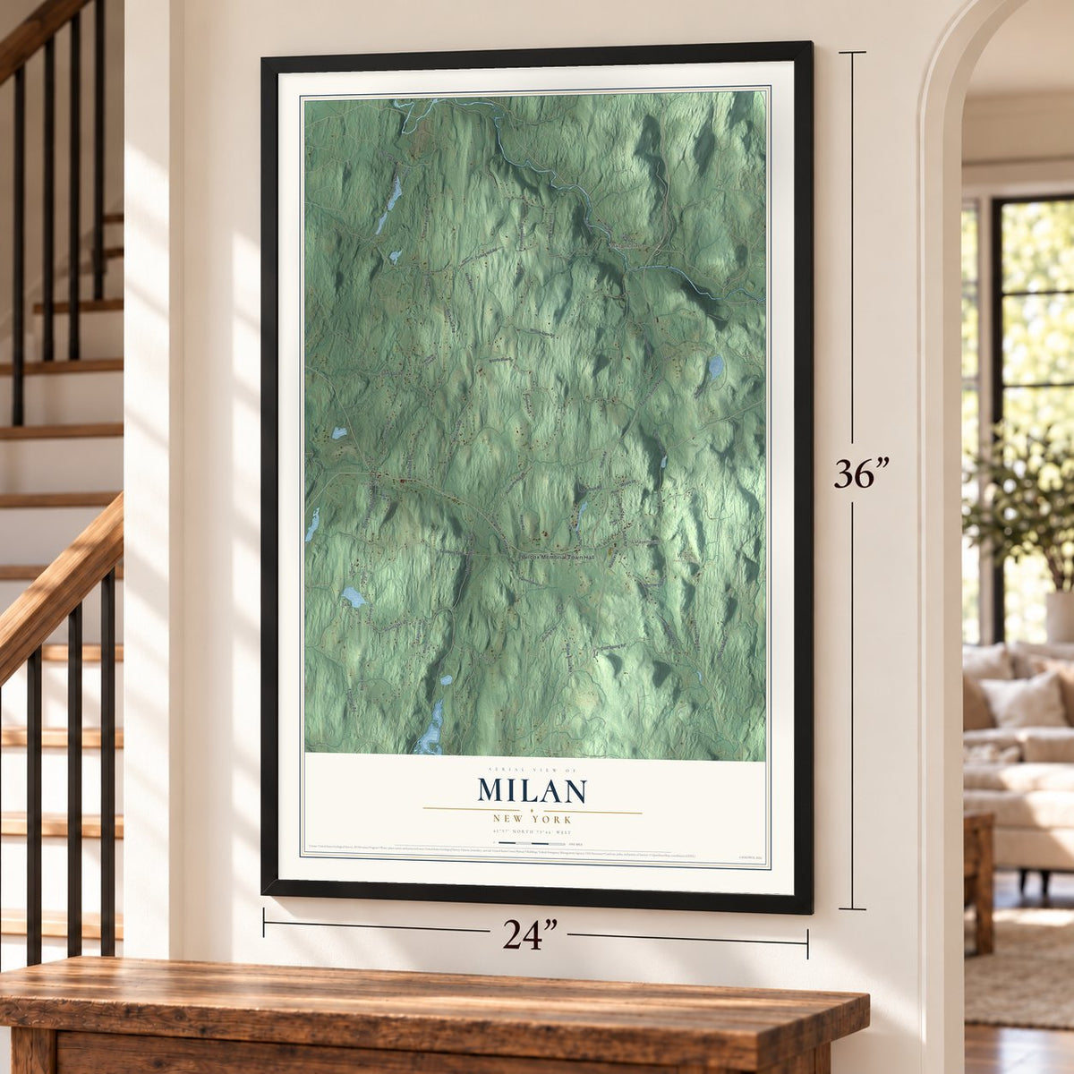 Milan, New York map, 24 x 36 inch print in a black frame by a staircase