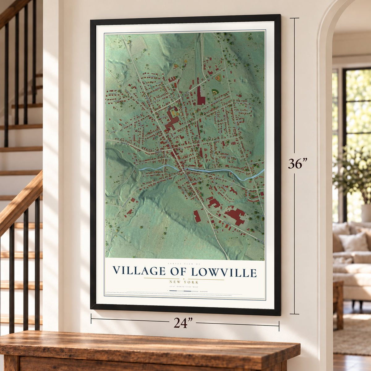 Village of Lowville, New York map, 24 x 36 inch print in a black frame by a staircase