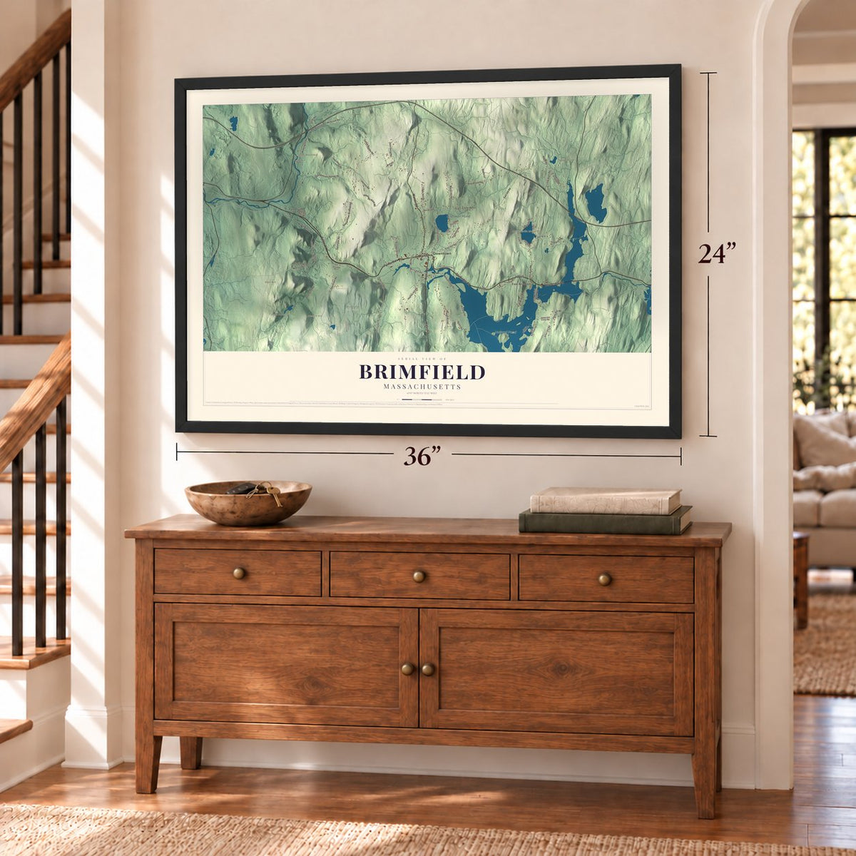 Brimfield, Massachusetts map, 24 x 36 inch print in a black frame above a dresser by a staircase