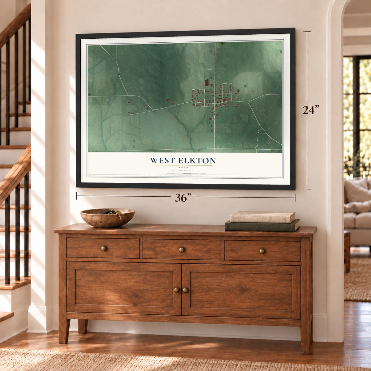 West Elkton, Ohio map, 24 x 36 inch print in a black frame above a dresser by a staircase