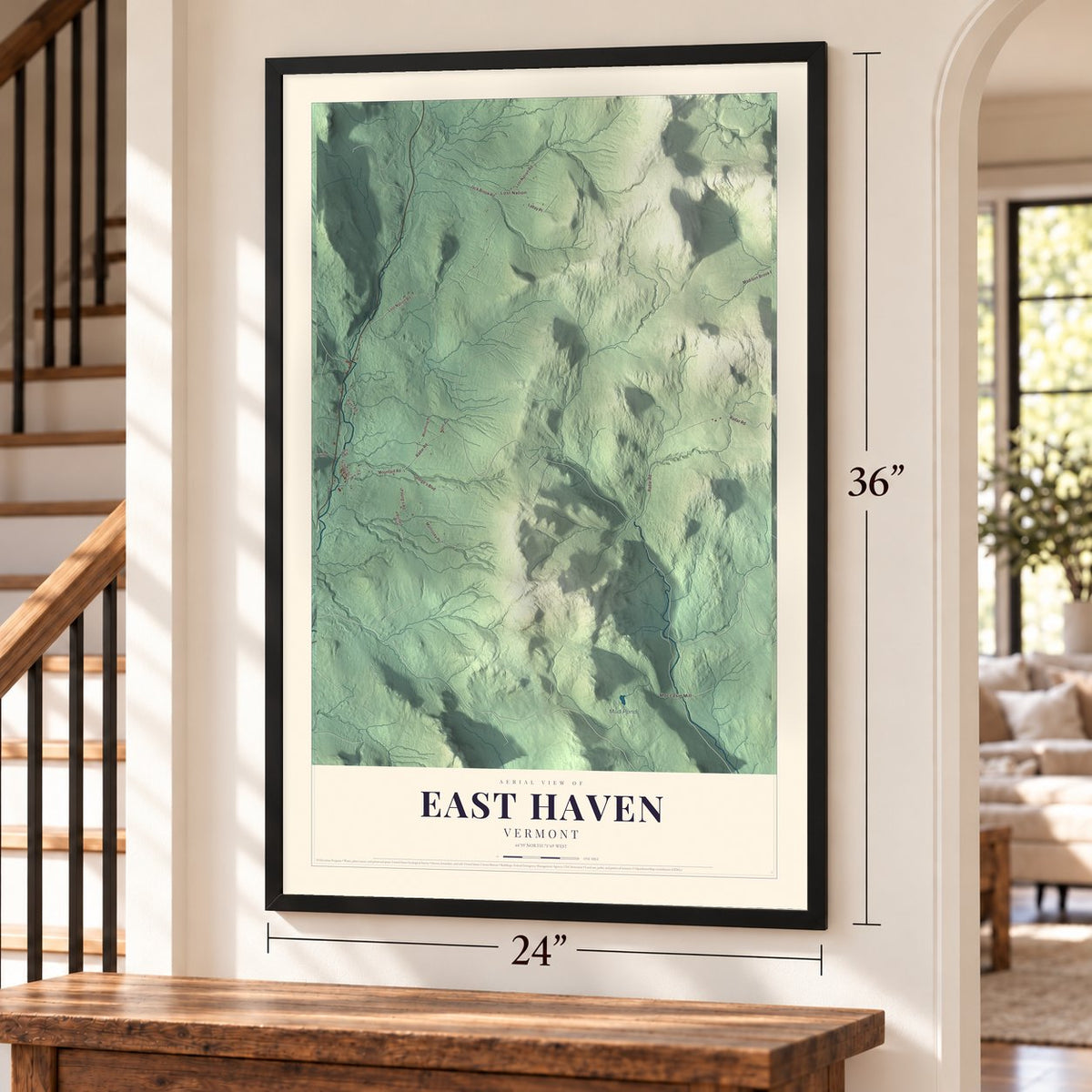 East Haven, Vermont map, 24 x 36 inch print in a black frame by a staircase