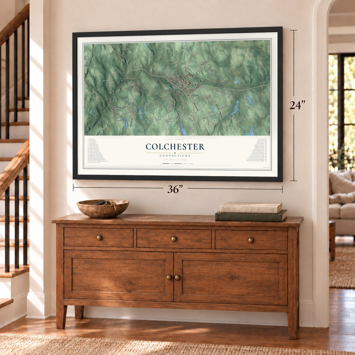 Colchester, Connecticut map, 24 x 36 inch print in a black frame above a dresser by a staircase