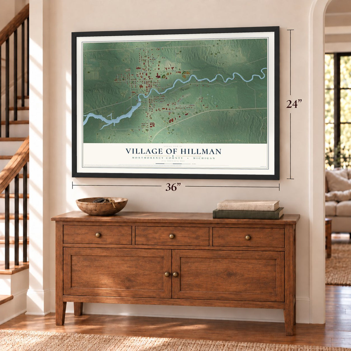 Hillman, Michigan map, 24 x 36 inch print in a black frame above a dresser by a staircase