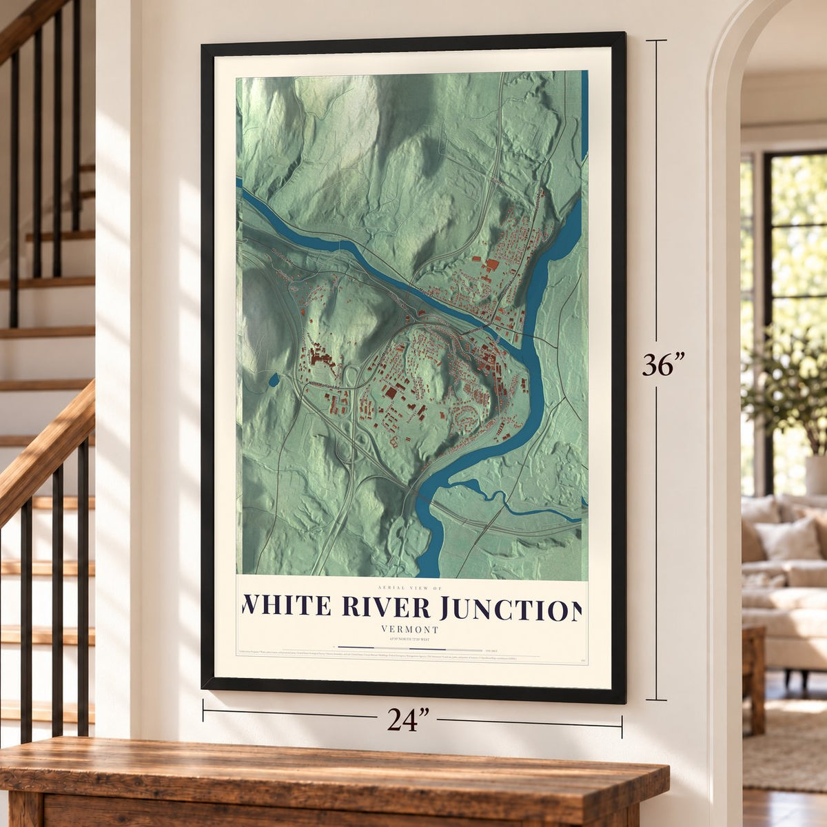 White River Junction, Vermont map, 24 x 36 inch print in a black frame by a staircase