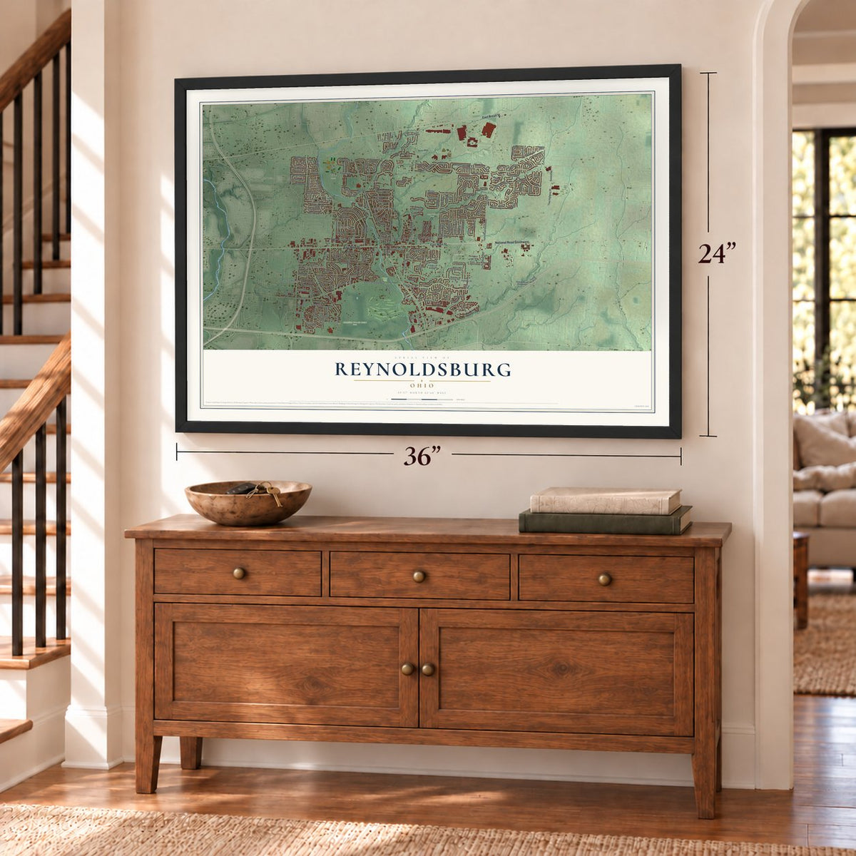 Reynoldsburg, Ohio map, 24 x 36 inch print in a black frame above a dresser by a staircase
