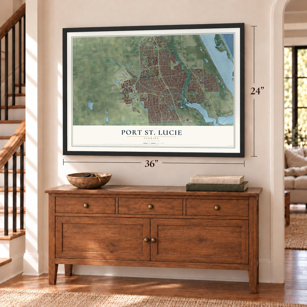 Port St. Lucie, Florida map, 24 x 36 inch print in a black frame above a dresser by a staircase