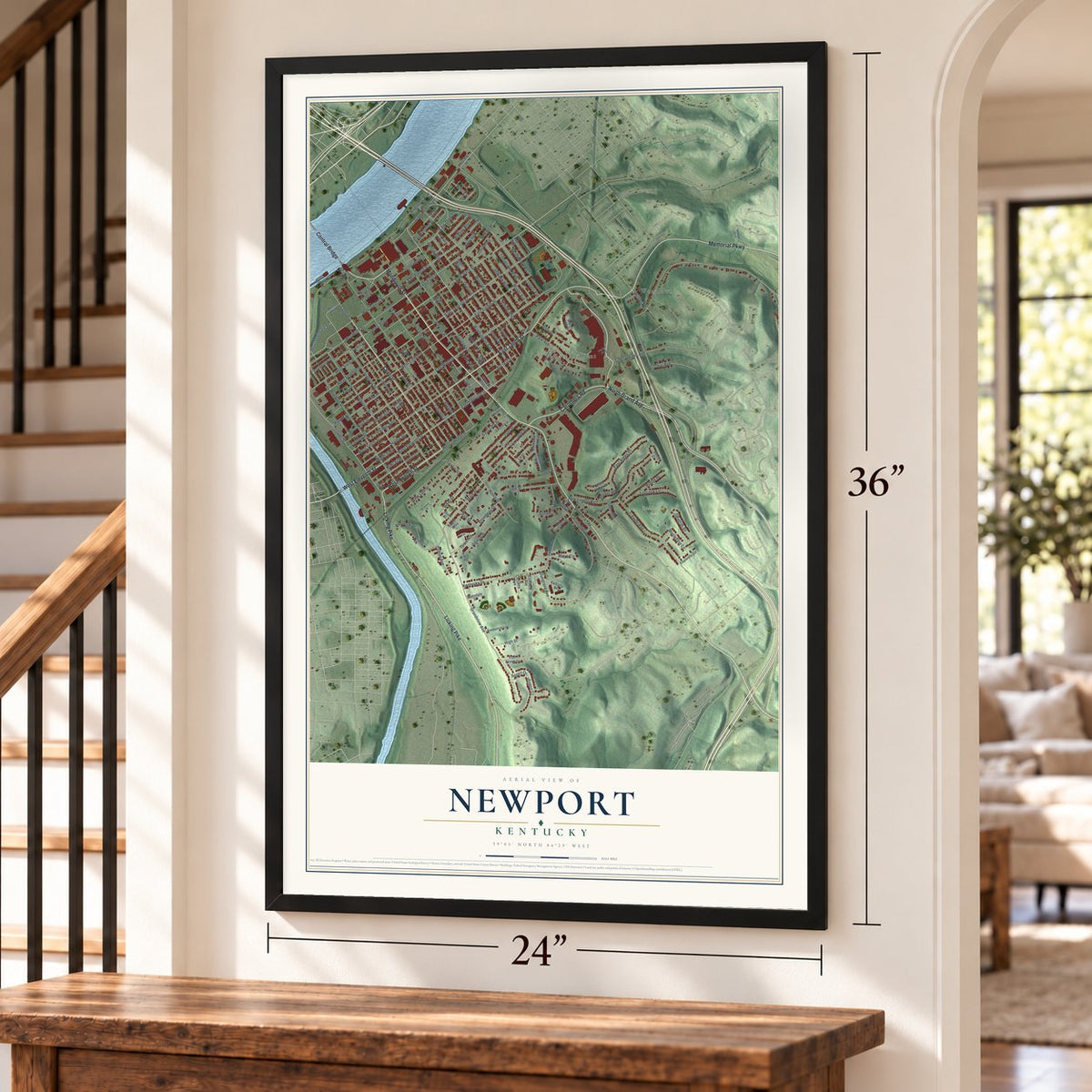 Newport, Kentucky map, 24 x 36 inch print in a black frame by a staircase