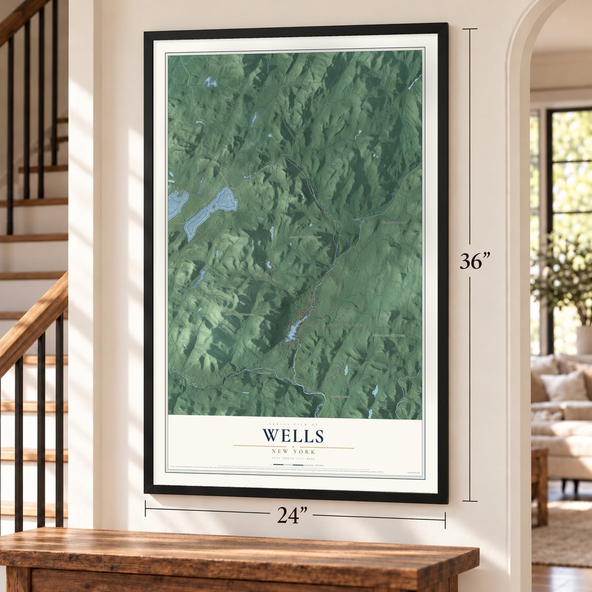 Wells, New York map, 24 x 36 inch print in a black frame by a staircase