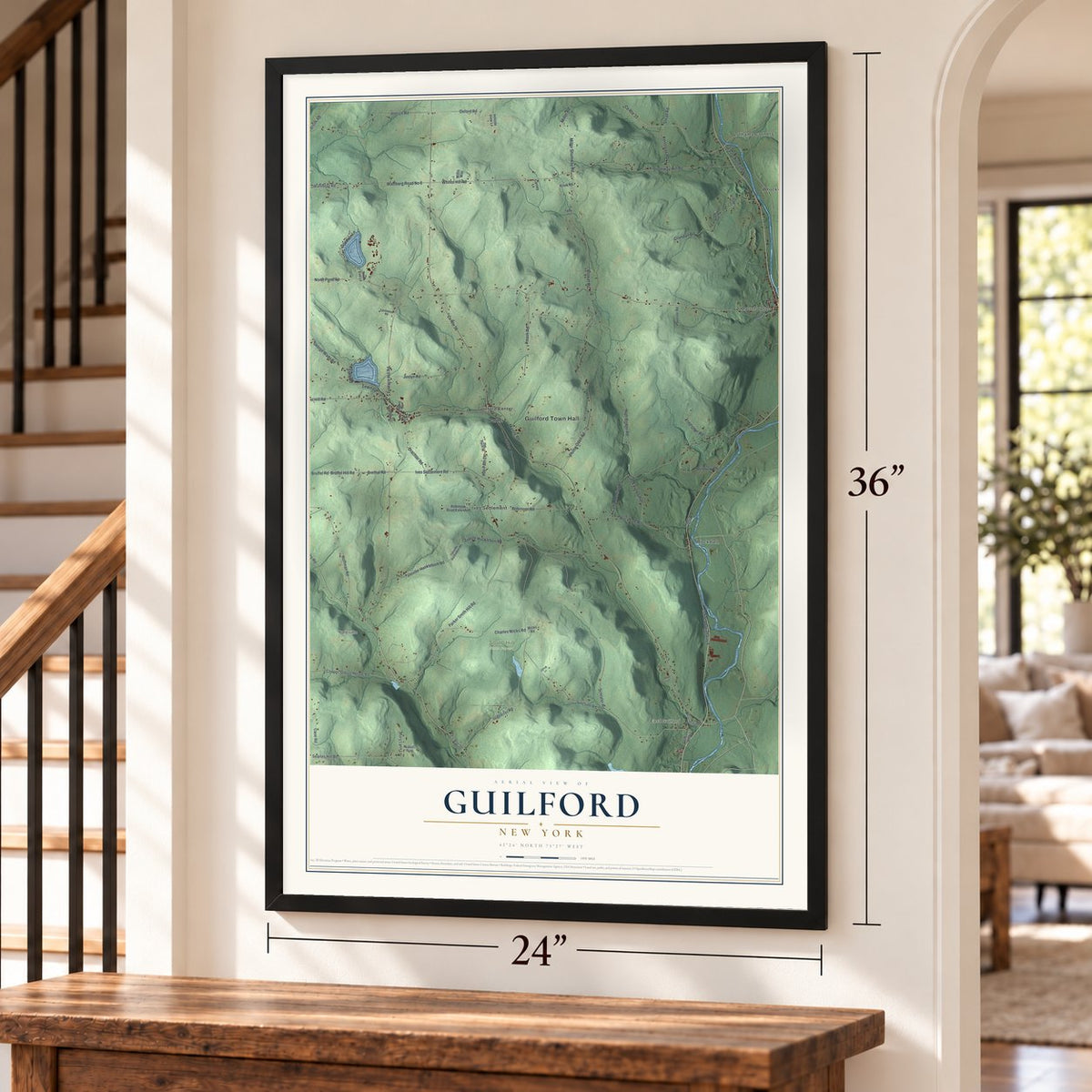 Guilford, New York map, 24 x 36 inch print in a black frame by a staircase