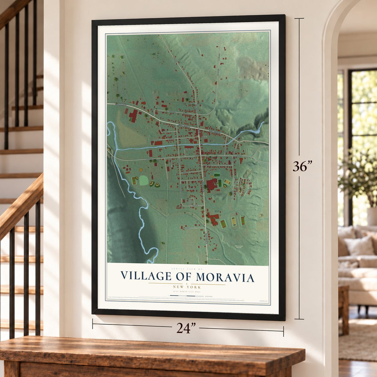 Village of Moravia, New York map, 24 x 36 inch print in a black frame by a staircase