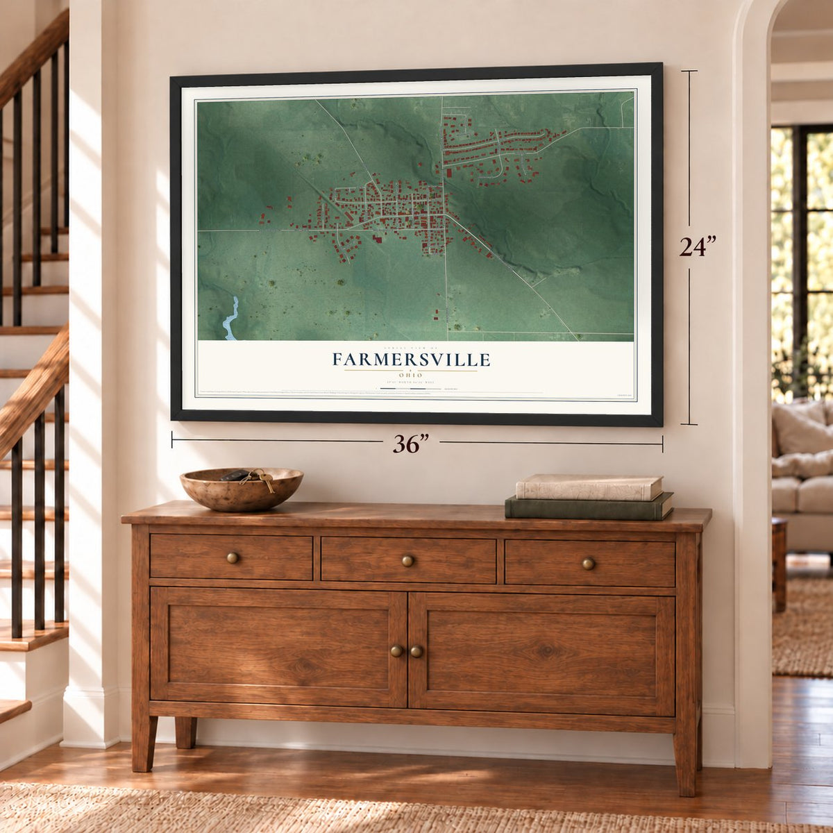 Farmersville, Ohio map, 24 x 36 inch print in a black frame above a dresser by a staircase