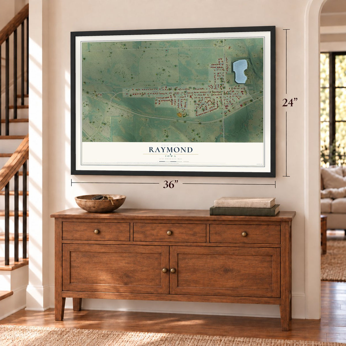 Raymond, Iowa map, 24 x 36 inch print in a black frame above a dresser by a staircase