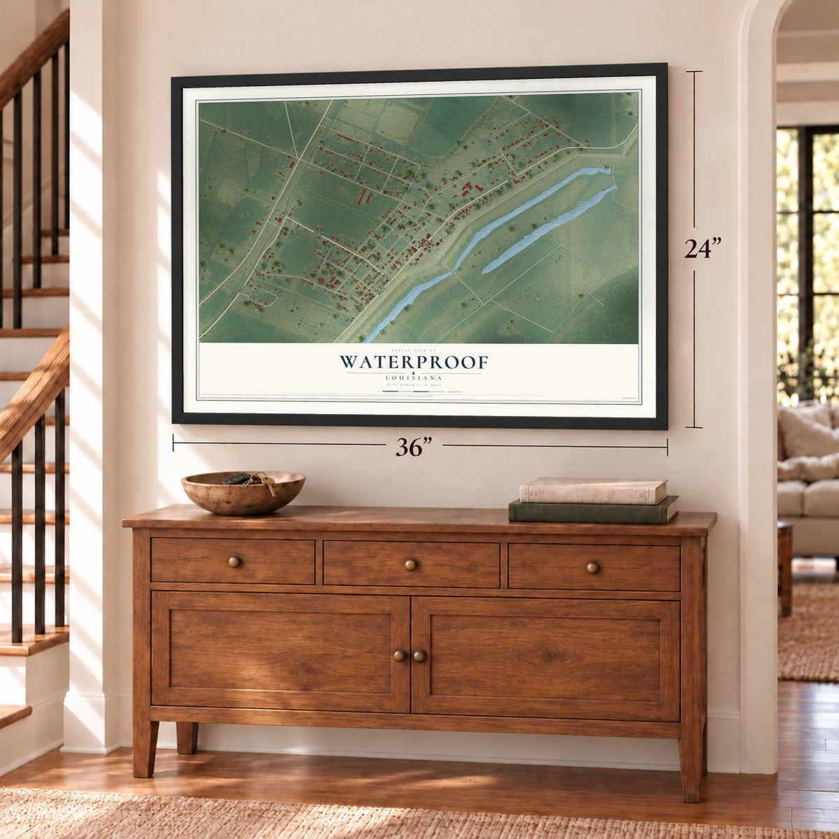 Waterproof, Louisiana map, 24 x 36 inch print in a black frame above a dresser by a staircase