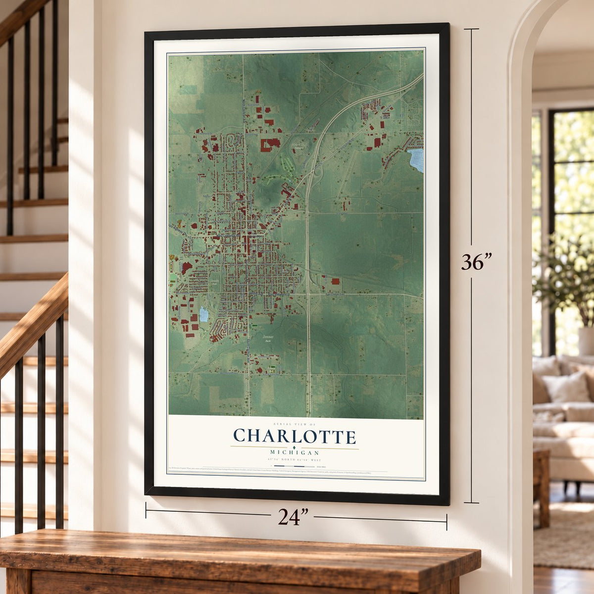 Charlotte, Michigan map, 24 x 36 inch print in a black frame by a staircase