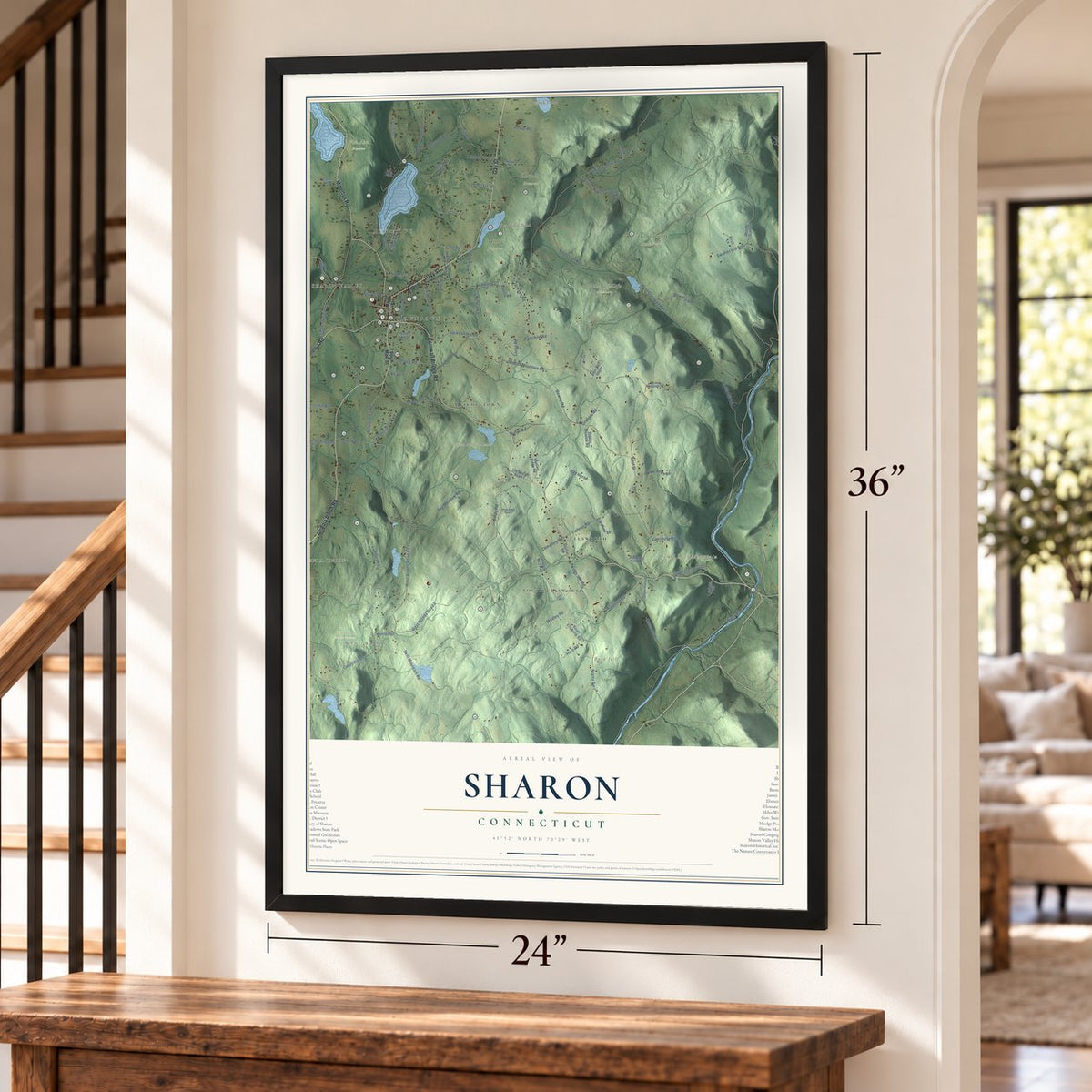 Sharon, Connecticut map, 24 x 36 inch print in a black frame by a staircase