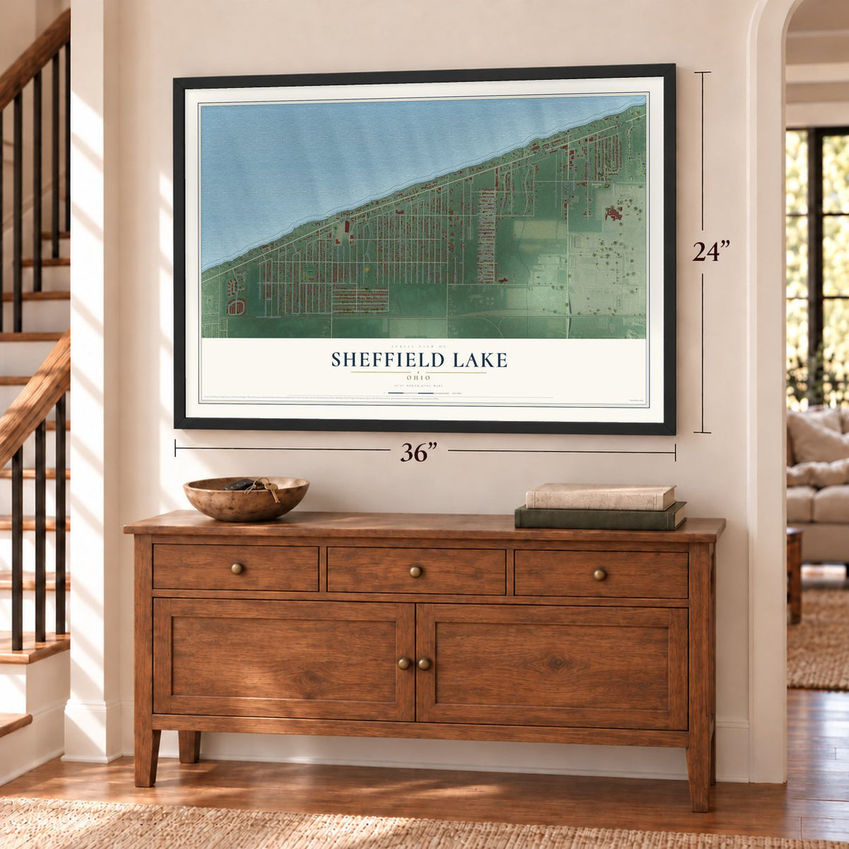 Sheffield Lake, Ohio map, 24 x 36 inch print in a black frame above a dresser by a staircase