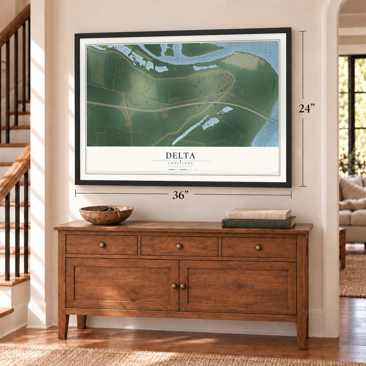 Delta, Louisiana map, 24 x 36 inch print in a black frame above a dresser by a staircase