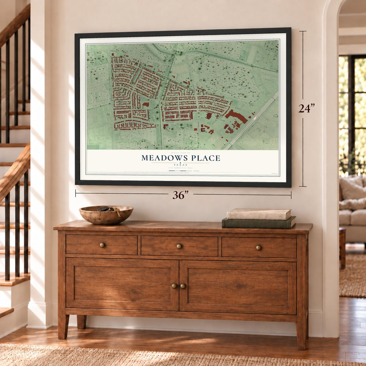 Meadows Place, Texas map, 24 x 36 inch print in a black frame above a dresser by a staircase