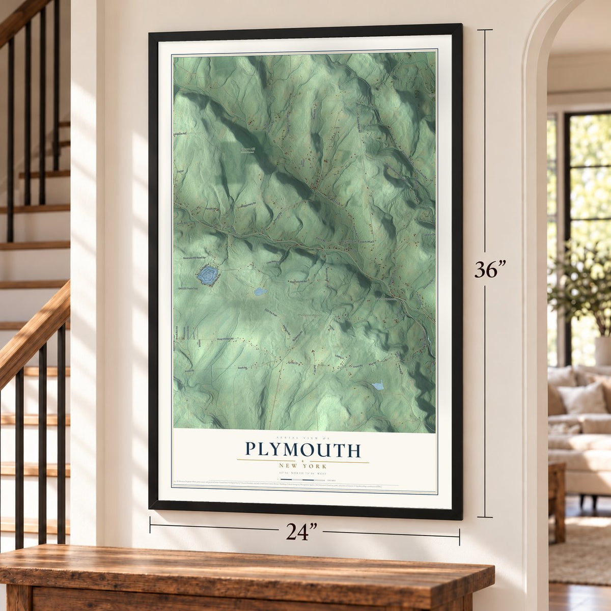 Plymouth, New York map, 24 x 36 inch print in a black frame by a staircase
