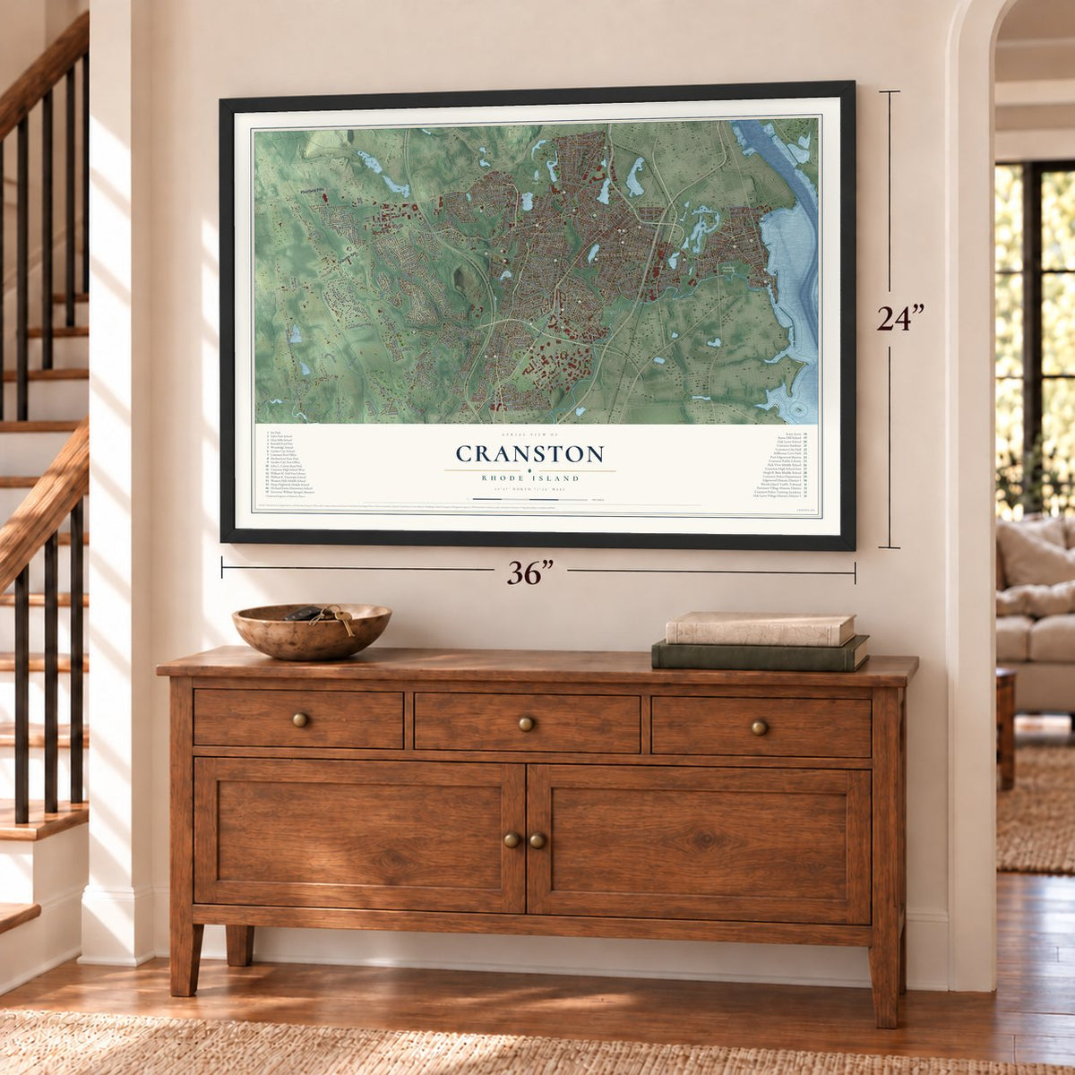 Cranston, Rhode Island map, 24 x 36 inch print in a black frame above a dresser by a staircase