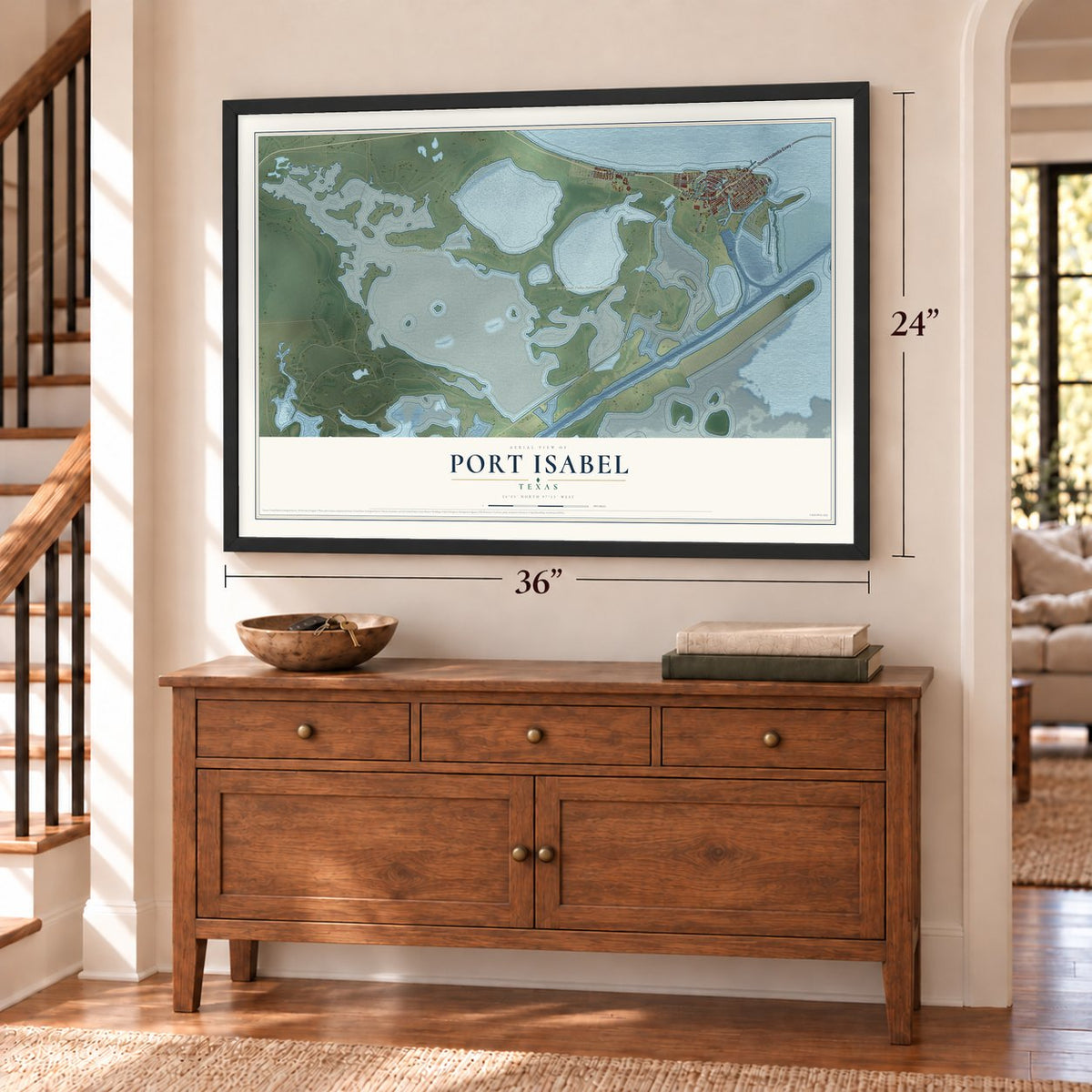 Port Isabel, Texas map, 24 x 36 inch print in a black frame above a dresser by a staircase