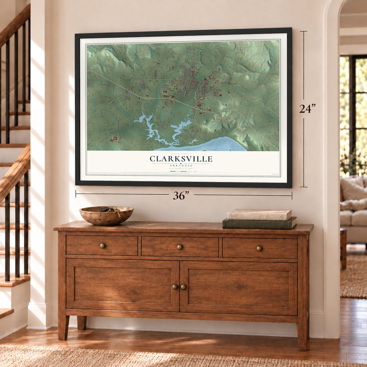 Clarksville, Arkansas map, 24 x 36 inch print in a black frame above a dresser by a staircase