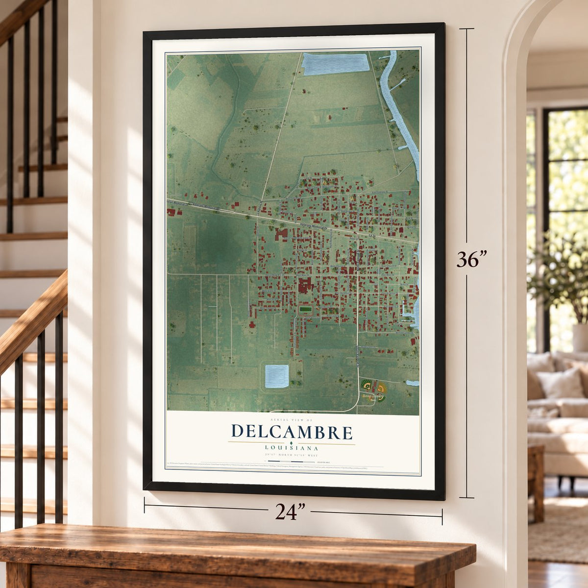 Delcambre, Louisiana map, 24 x 36 inch print in a black frame by a staircase