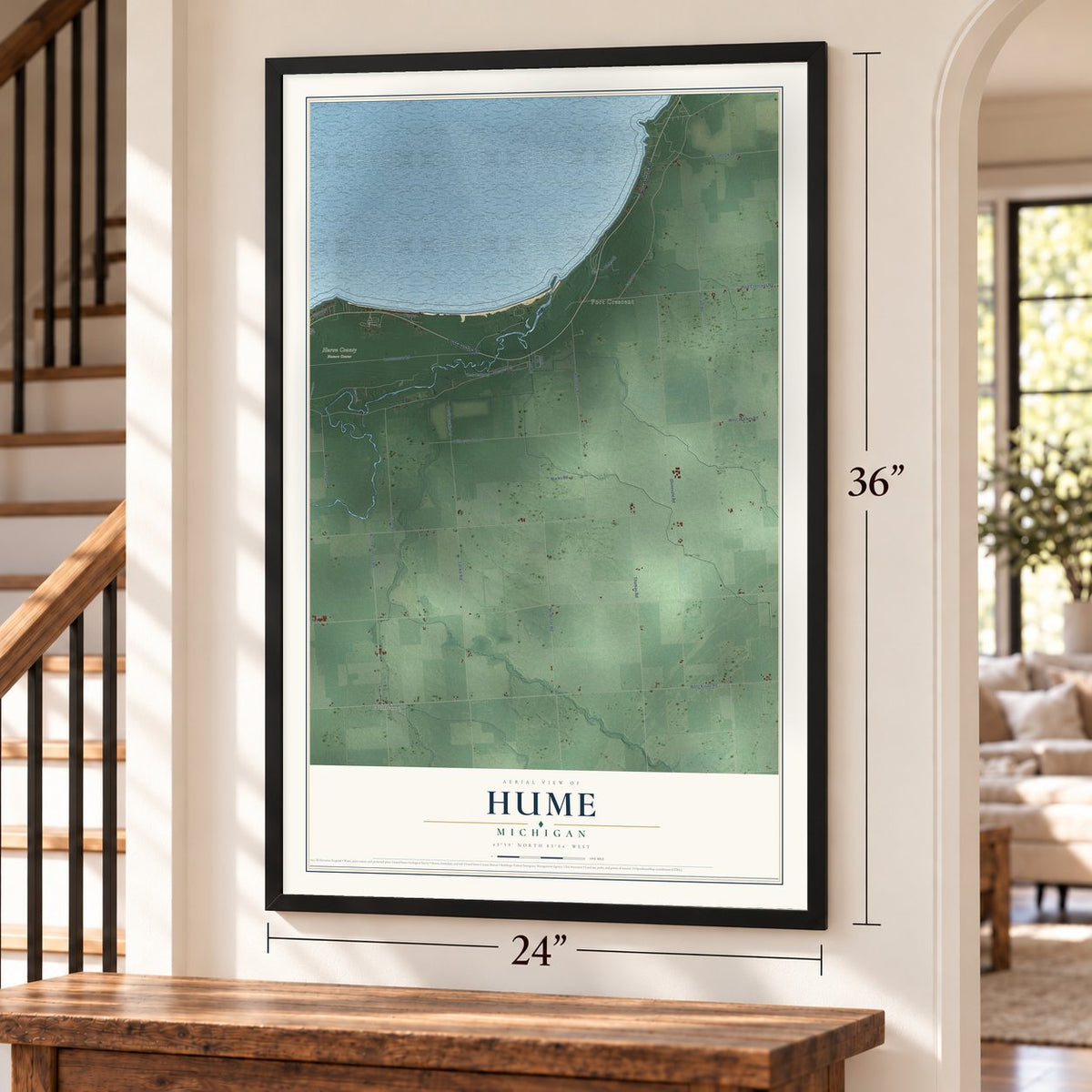 Hume, Michigan map, 24 x 36 inch print in a black frame by a staircase
