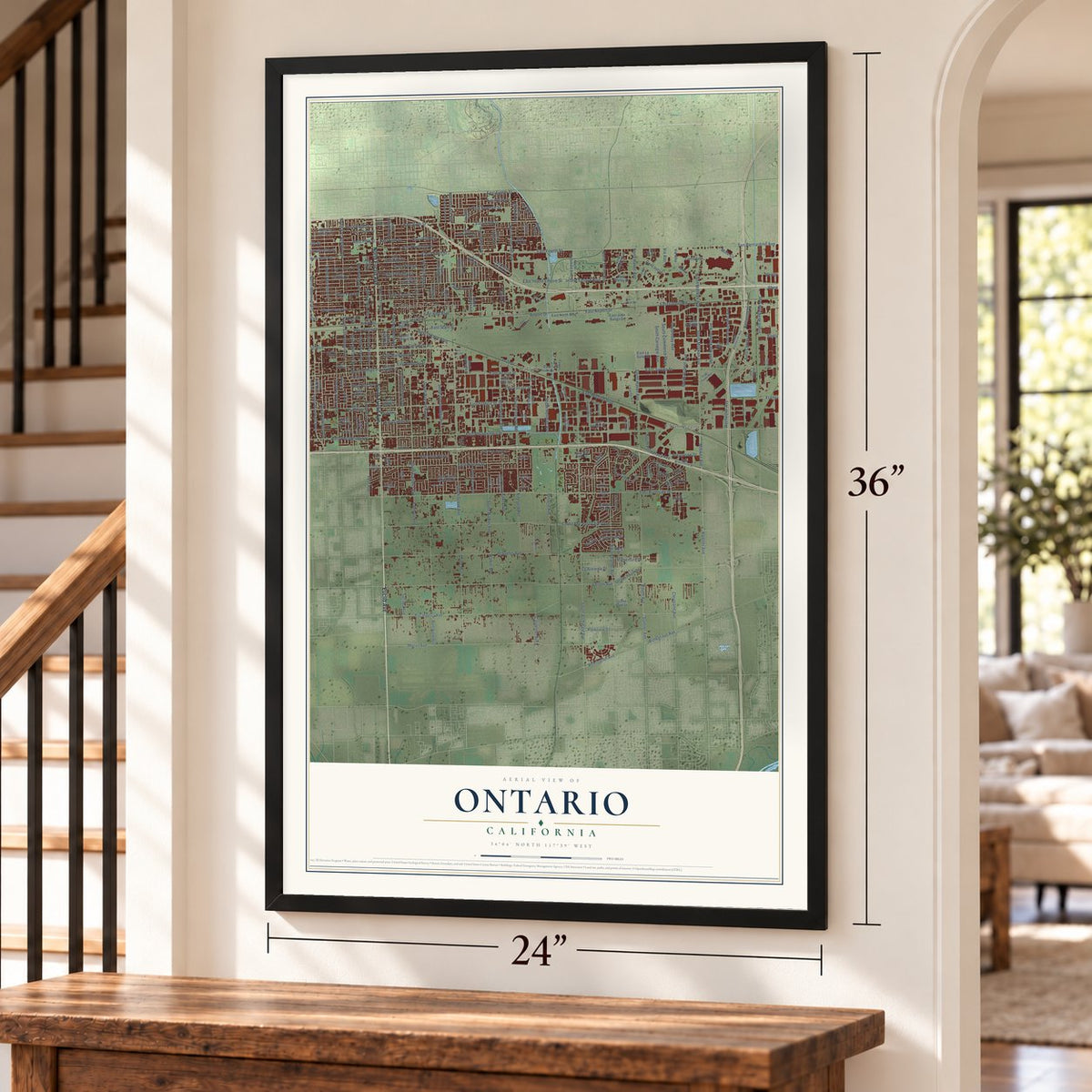 Ontario, California map, 24 x 36 inch print in a black frame by a staircase