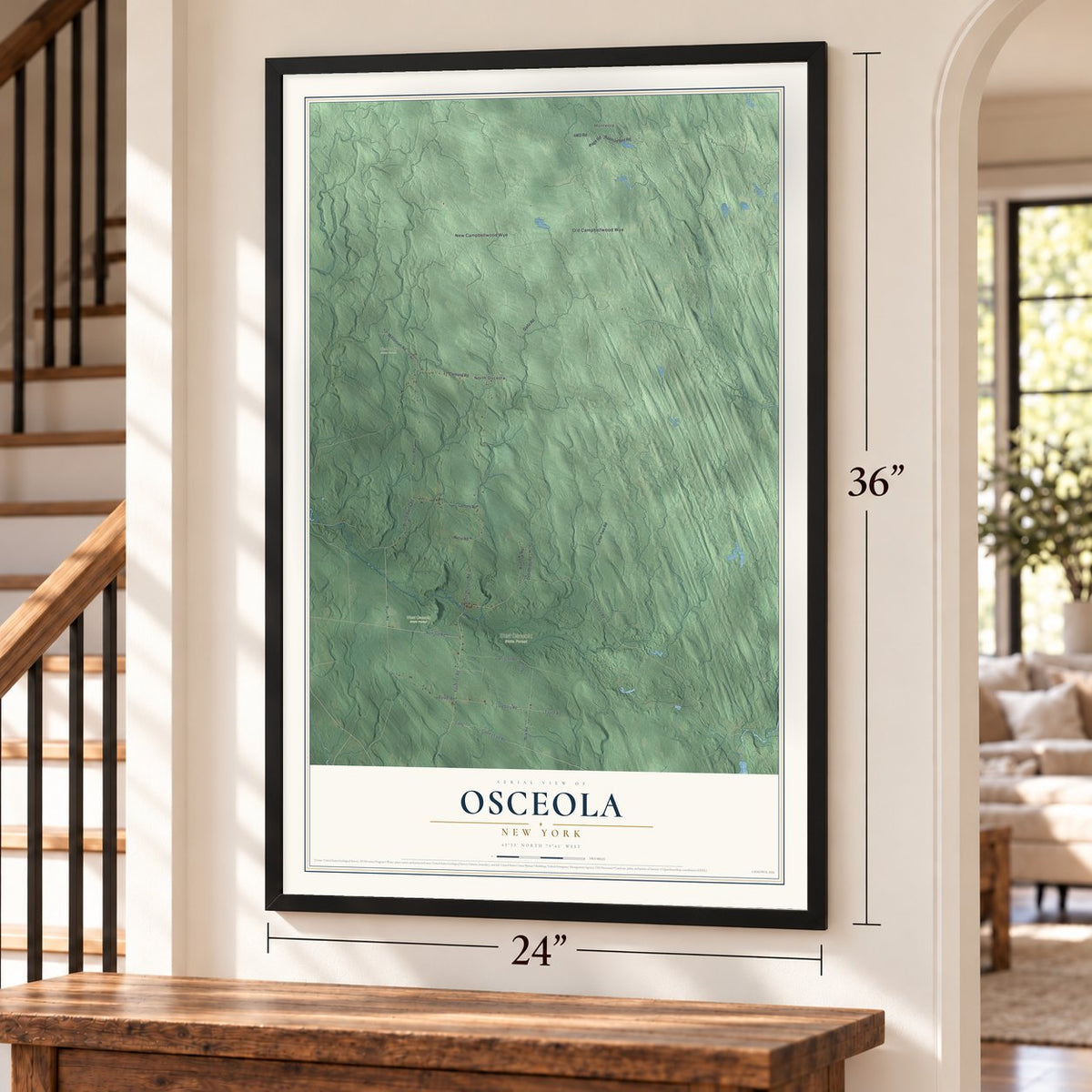 Osceola, New York map, 24 x 36 inch print in a black frame by a staircase