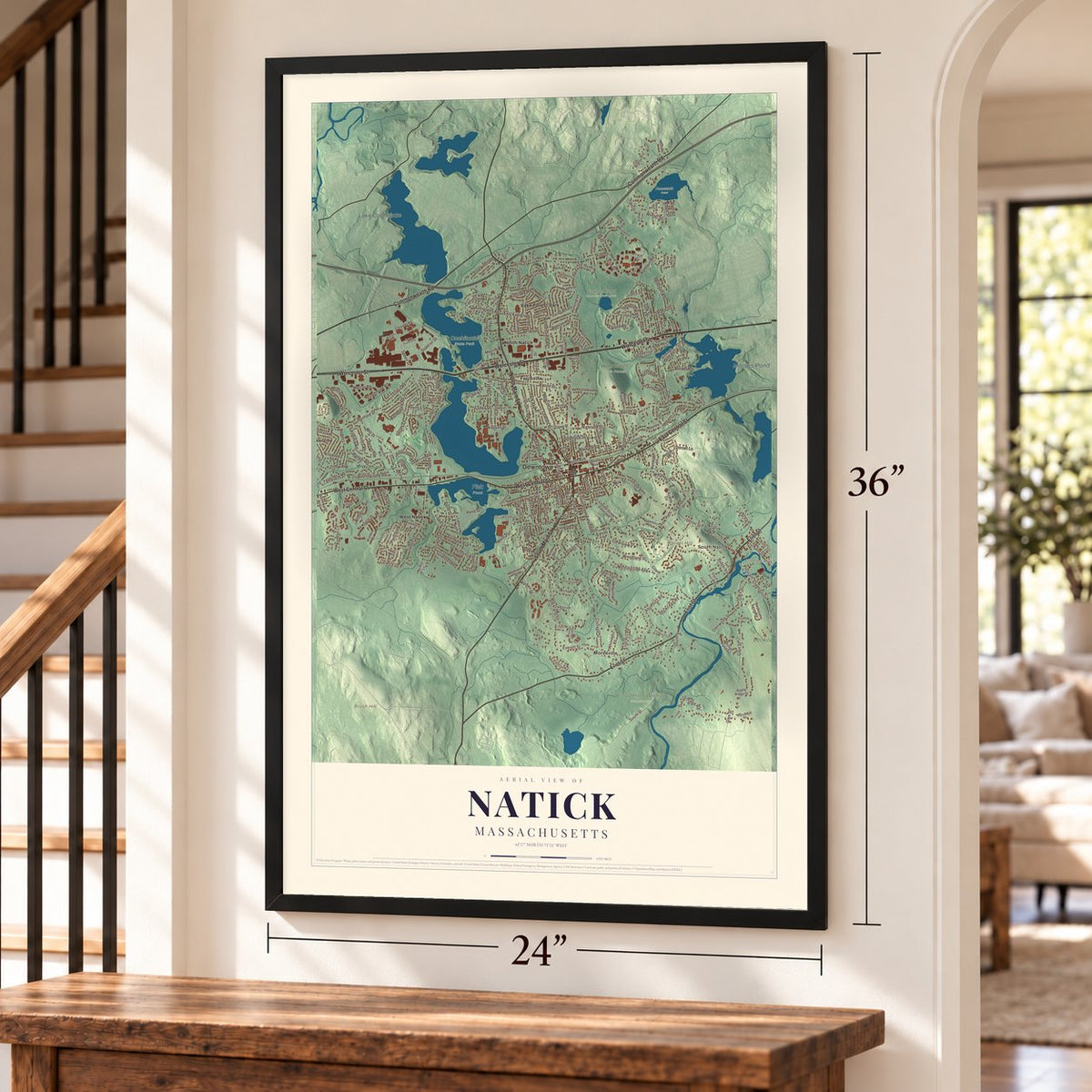 Natick, Massachusetts map, 24 x 36 inch print in a black frame by a staircase