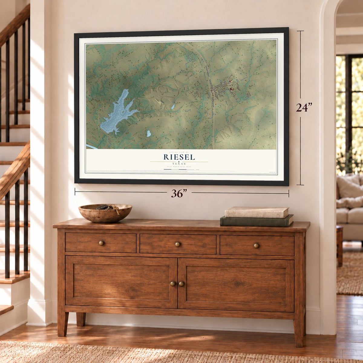 Riesel, Texas map, 24 x 36 inch print in a black frame above a dresser by a staircase