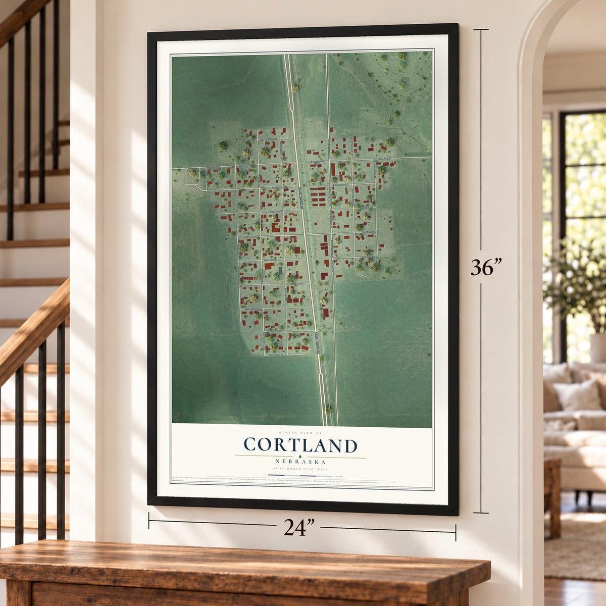 Cortland, Nebraska map, 24 x 36 inch print in a black frame by a staircase