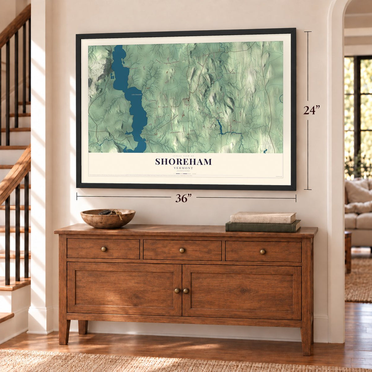 Shoreham, Vermont map, 24 x 36 inch print in a black frame above a dresser by a staircase