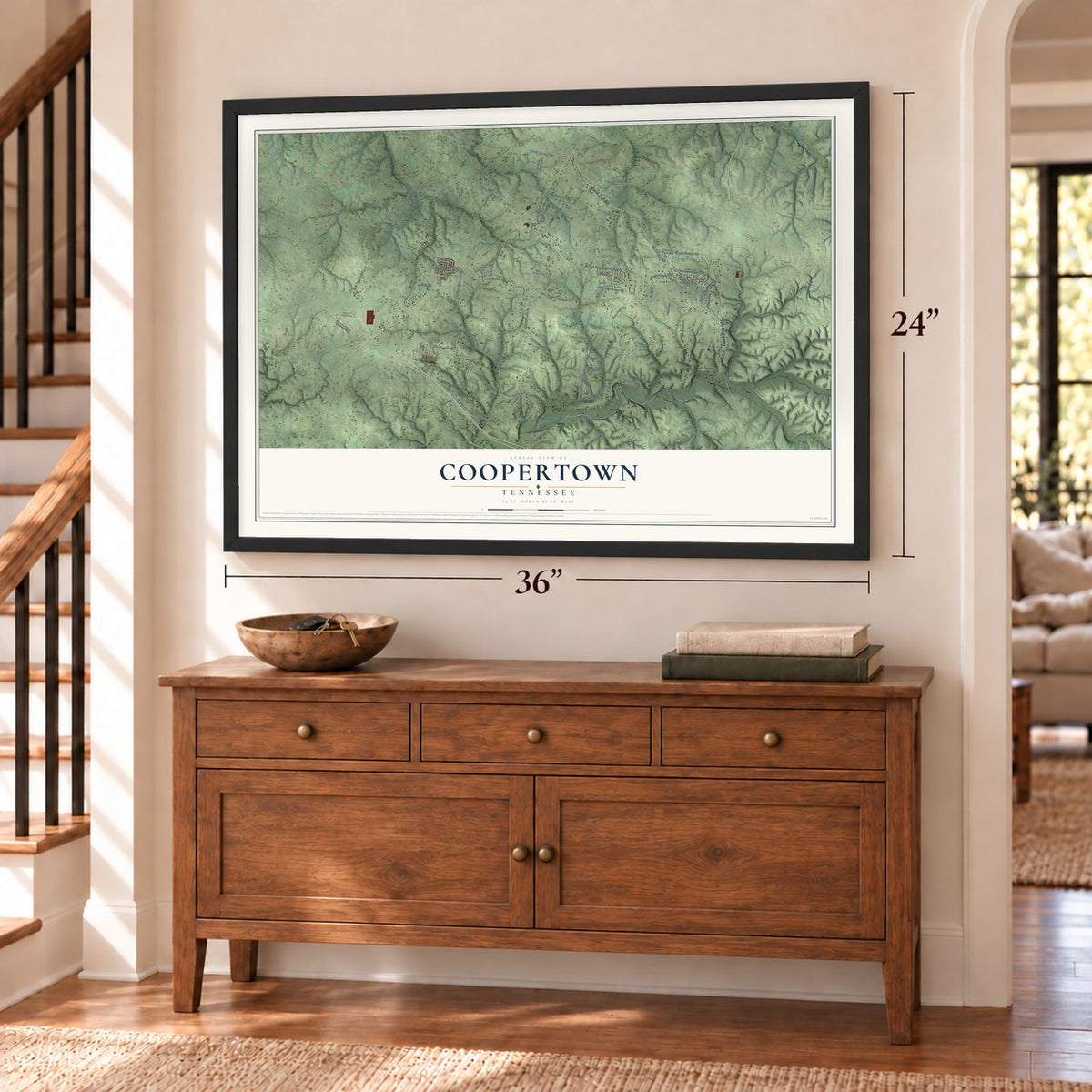 Coopertown, Tennessee map, 24 x 36 inch print in a black frame above a dresser by a staircase