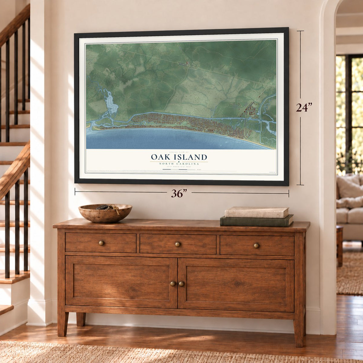 Oak Island, North Carolina map, 24 x 36 inch print in a black frame above a dresser by a staircase