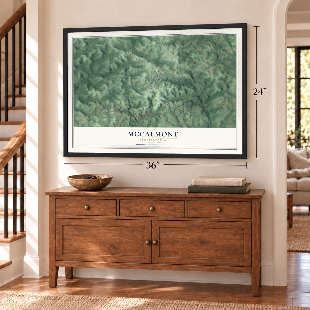 McCalmont, Pennsylvania map, 24 x 36 inch print in a black frame above a dresser by a staircase