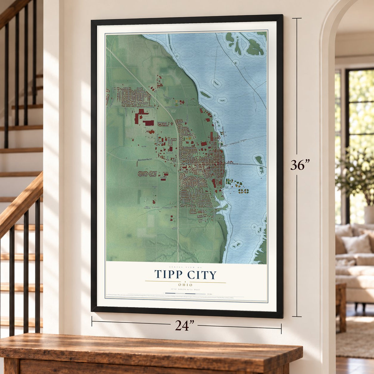 Tipp City, Ohio map, 24 x 36 inch print in a black frame by a staircase