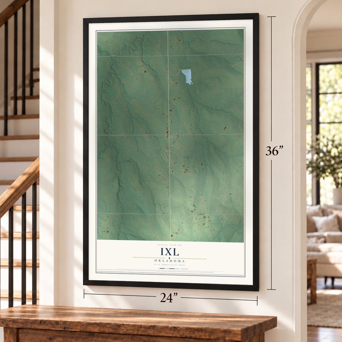 IXL, Oklahoma map, 24 x 36 inch print in a black frame by a staircase