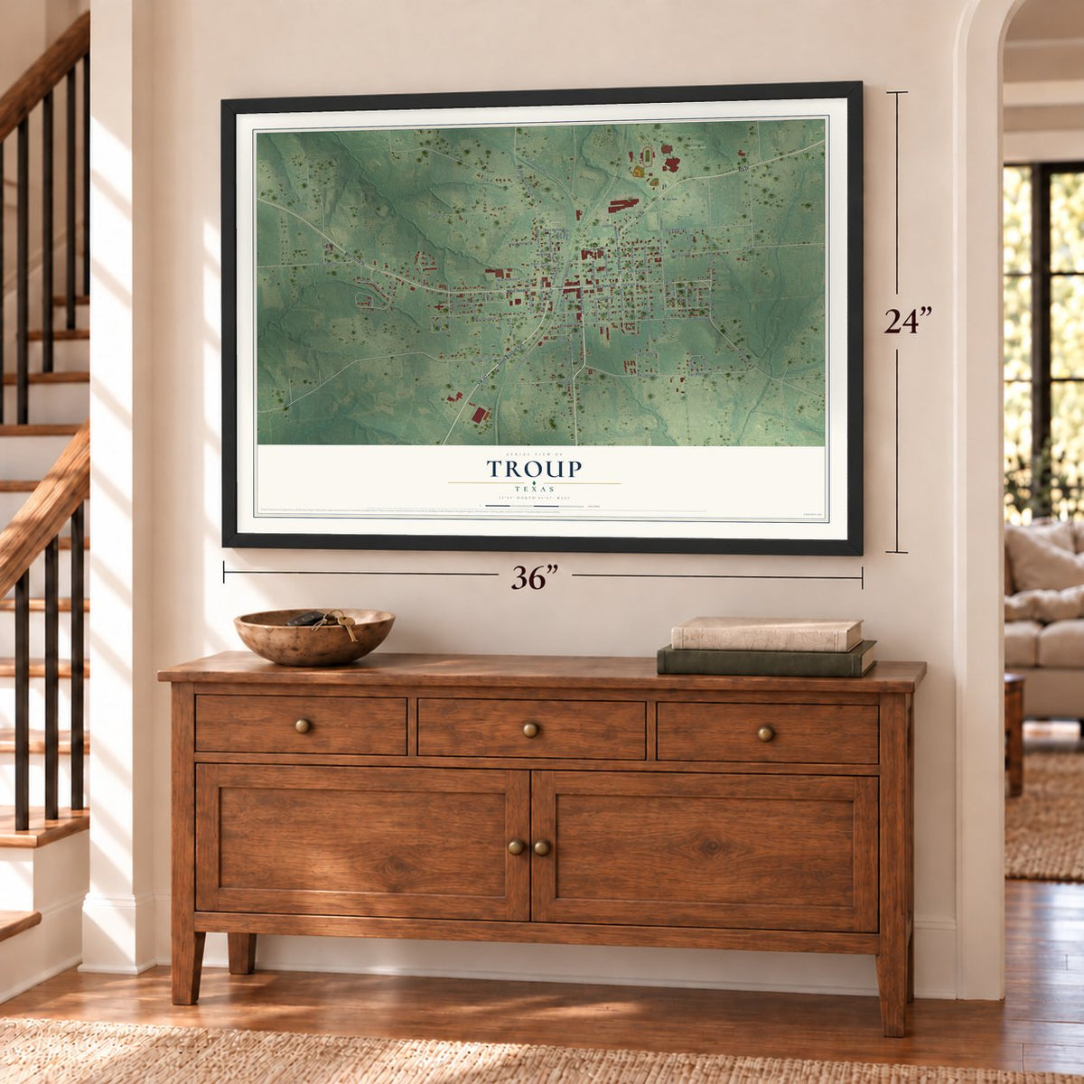 Troup, Texas map, 24 x 36 inch print in a black frame above a dresser by a staircase