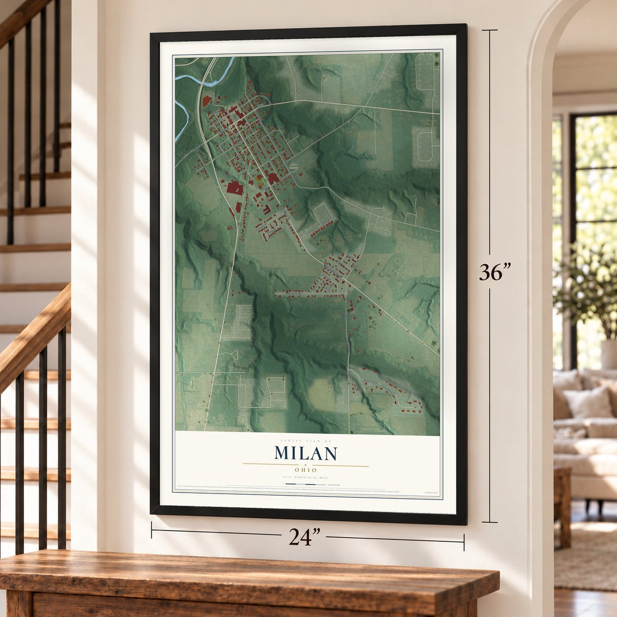 Milan, Ohio map, 24 x 36 inch print in a black frame by a staircase