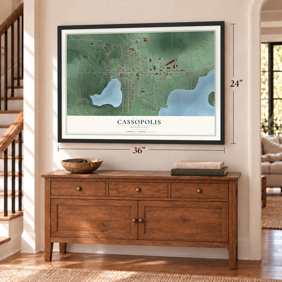 Cassopolis, Michigan map, 24 x 36 inch print in a black frame above a dresser by a staircase