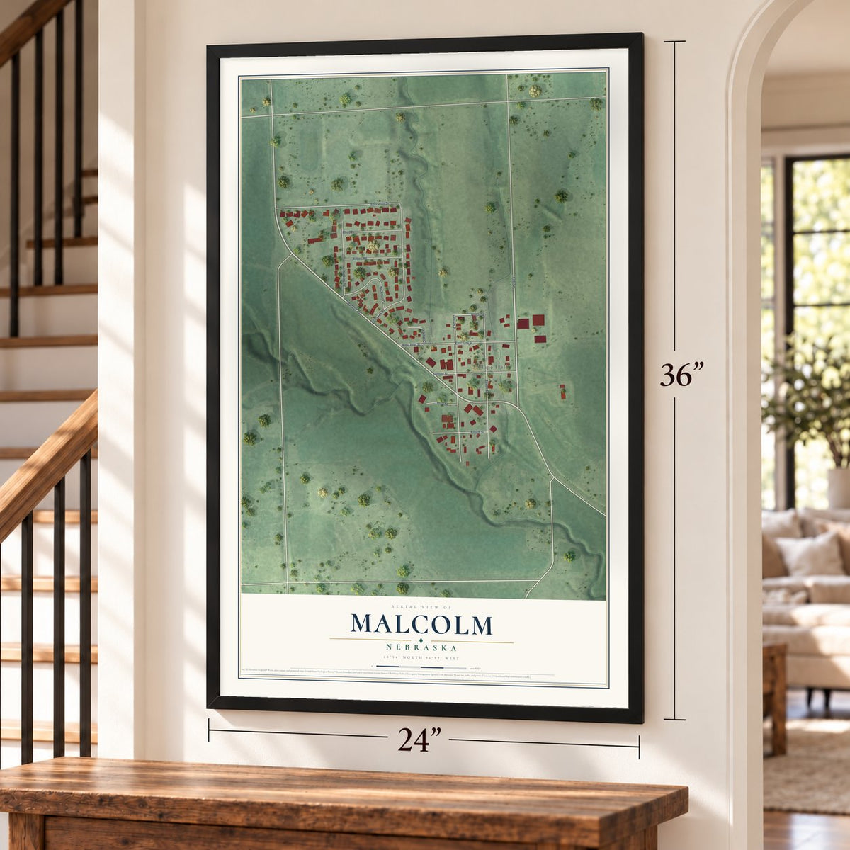 Malcolm, Nebraska map, 24 x 36 inch print in a black frame by a staircase