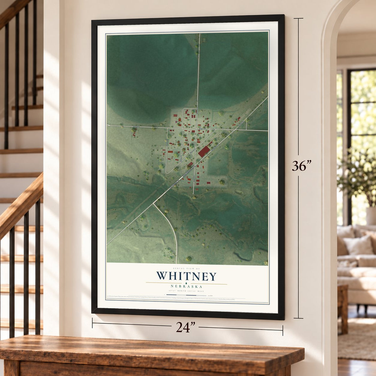 Whitney, Nebraska map, 24 x 36 inch print in a black frame by a staircase