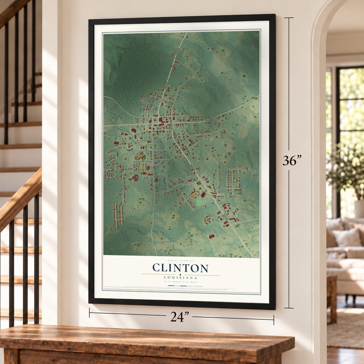 Clinton, Louisiana map, 24 x 36 inch print in a black frame by a staircase