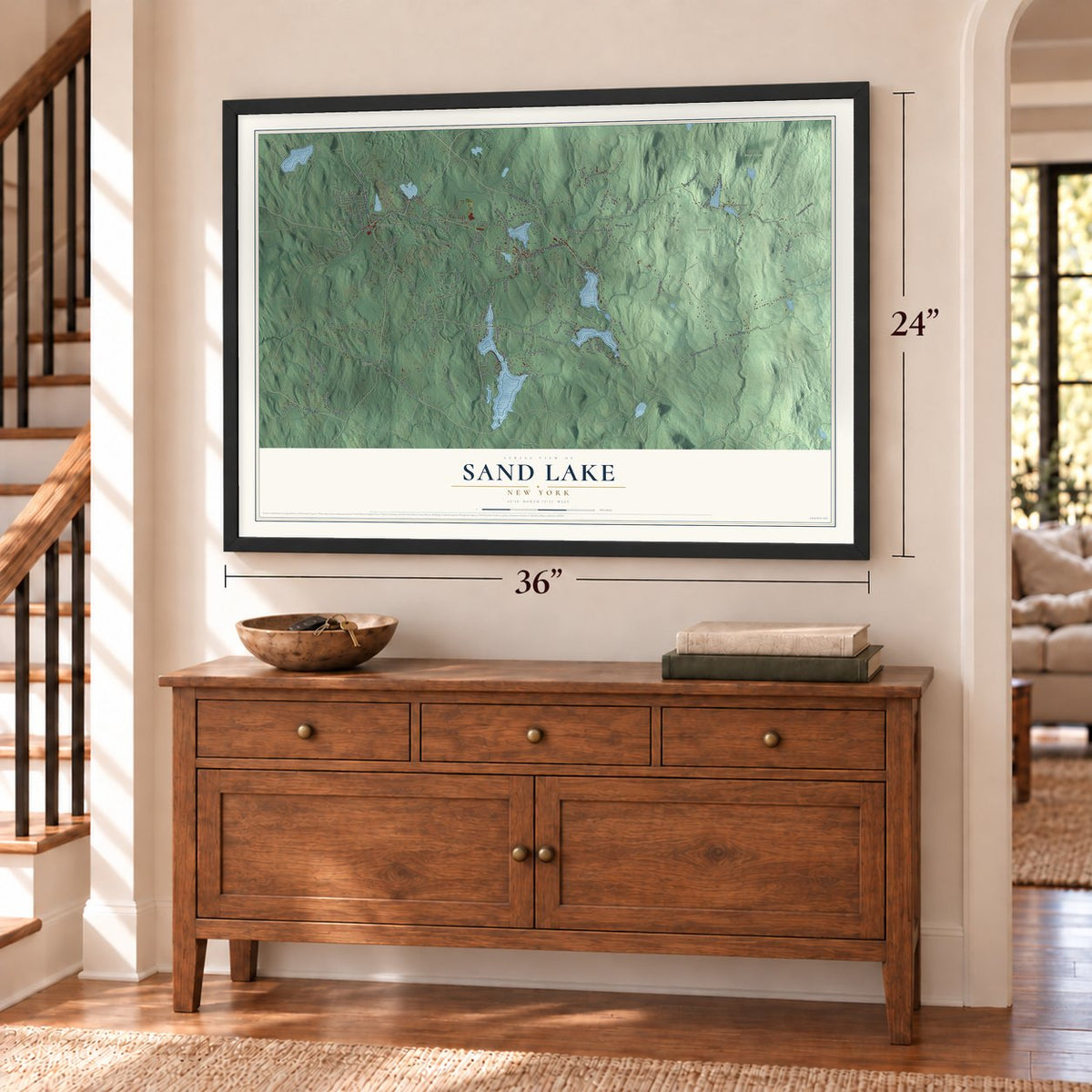 Sand Lake, New York map, 24 x 36 inch print in a black frame above a dresser by a staircase